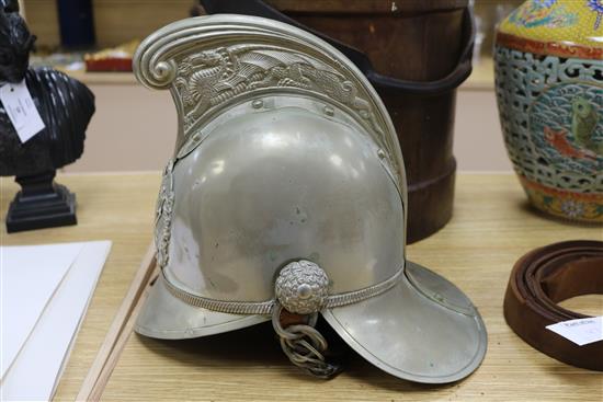 A firemans helmet and a leather belt